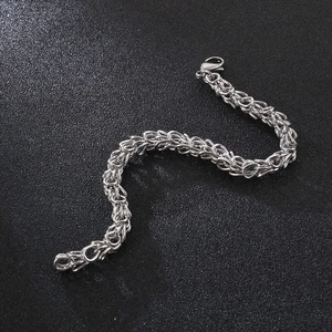 Detailed view of silver stainless steel Byzantine chain with a secure lobster clasp