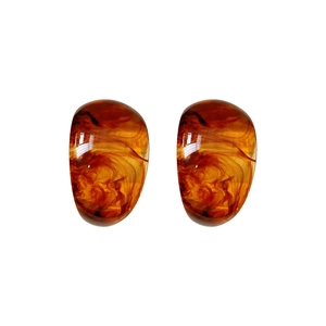 Minimalist vintage C-shape amber resin stud earrings with artistic mottled pattern