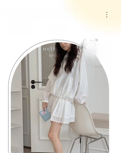 Detail of white lace hem skirt paired with breathable silk crew socks for a soft look