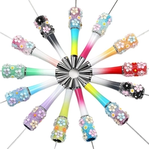 DIY bead pens with colorful gradient barrels and decorative floral resin ornaments