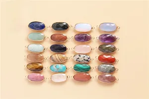 Macro display of 24 types of faceted natural stone connectors with gold-plated edges