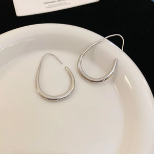 Minimalist silver teardrop open hoop earrings with polished metal finish for women