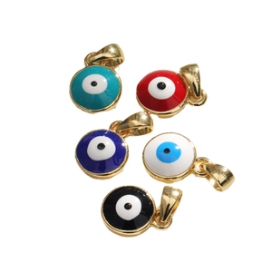 Five colorful round evil eye pendants with gold plating and enamel finishes for jewelry DIY