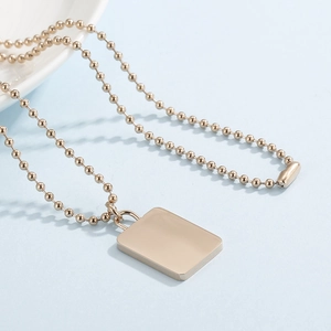 Minimalist 18K gold plated bead chain necklace featuring a polished square lock pendant