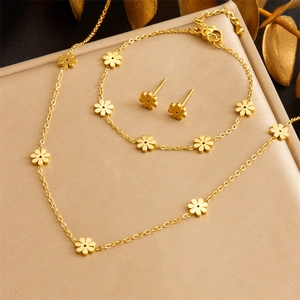 Three-piece gold-plated stainless steel jewelry set with delicate floral pendants