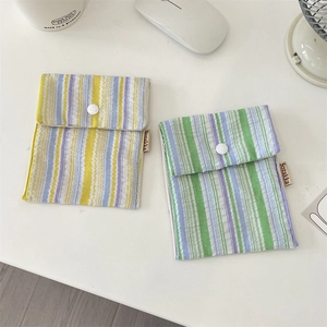 Detail of floral striped sanitary napkin storage bags with snap button and brand label