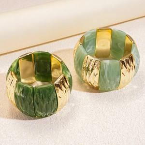 Detailed close-up of marble resin acrylic bracelets with gold metal leaf vein texture