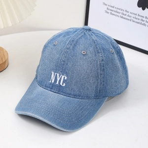 Vintage washed denim baseball cap with white NYC embroidery and adjustable fit