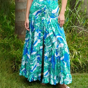 Detailed view of bohemian tropical jungle print with vibrant bird and floral motifs