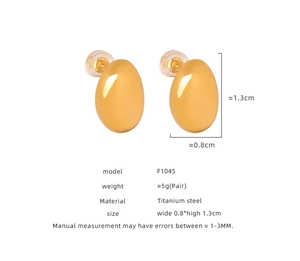 Macro shot of 18K gold plated oval earrings with clear size specs and silicone backs