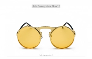 Front macro view of retro steampunk sunglasses with gold metal frame and yellow lenses