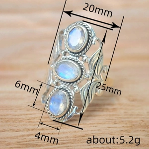 Vintage oval blue moonstone ring with 25mm height and intricate silver floral engraving