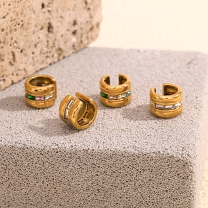 Macro shot of 18K gold plated C-shape ear cuffs with colorful inset zircon gemstones