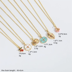 Set of six gold crab and cherry pendant necklaces with dimensions and chain lengths