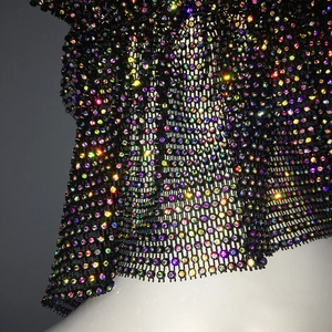 Macro detail of black mesh headwear with sparkling aurora rhinestones for party fashion