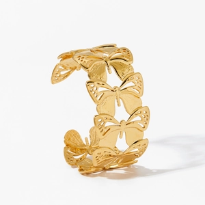 Bracelet manchette doré réglable en forme de C avec motifs de papillons ajourés