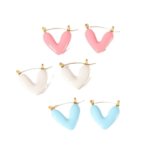 Three pairs of colorful heart hoop earrings in pink, white, and blue enamel on gold-plated steel