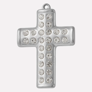 Macro shot of silver stainless steel cross pendant with inlaid clear rhinestones detail