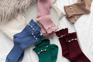 Ribbed mid-calf socks with pearl and silver bead accents in five different soft colors