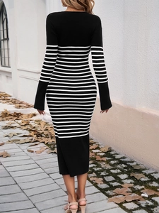 Back view of elegant striped knit dress with tight fit and stylish back slit detail