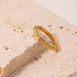 Irregular hammered 18K gold plated titanium steel ring with a square zircon inlay