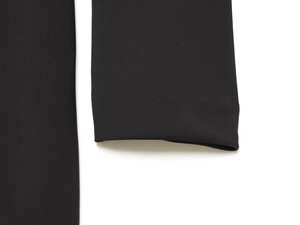 Close-up of black knitted long sleeve dress fabric texture and professional stitching