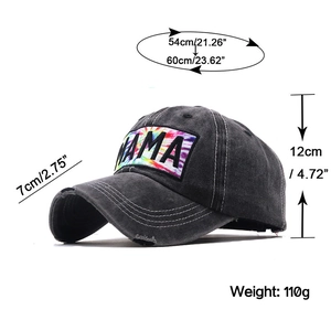 Detail view of distressed baseball cap featuring colorful MAMA embroidery and tie-dye patch