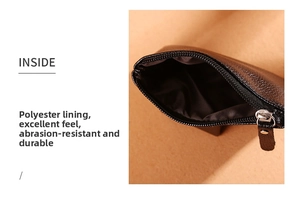Close-up of black litchi pattern PU leather coin purse with silver zipper and brown lining