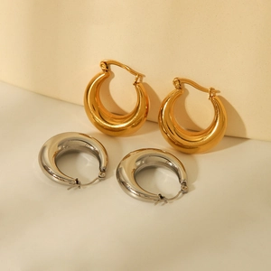 Minimalist thick gold and silver hoop earrings with hollow geometric circular design