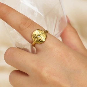 18k gold plated stainless steel star ring with a white zircon on a hammered irregular band