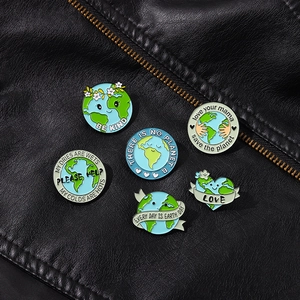 Detailed set of six enamel Earth Day badges on black leather with eco-friendly slogans