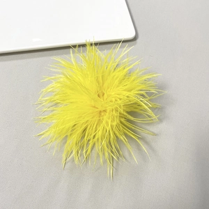 Elegant bright yellow ostrich feather brooch and hair clip accessory for festive parties
