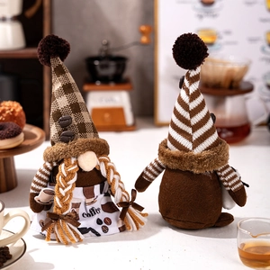 Detail view of coffee gnome set with striped and plaid hats on a warm coffee bar scene
