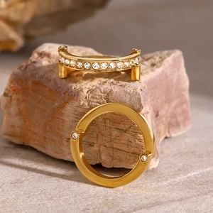 Close-up of polished gold-plated ring components with micro-pave white zircon stones