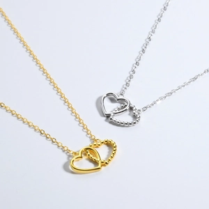 Minimalist S925 silver interlocking heart pendant necklace in gold and silver finish