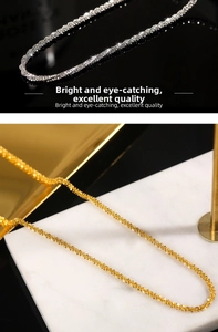 Detail shot of sparkling fine-textured necklaces in polished gold and silver finishes