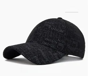 Detail of black baseball cap featuring textured fabric and INSUN jacquard pattern