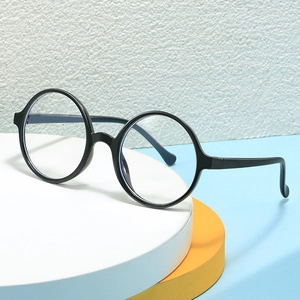 Classic round black frame kids glasses for styling and photos, presented on circular props