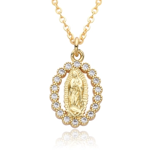 Detail of 18k gold plated Virgin Mary pendant with white zircon stones and sleek necklace