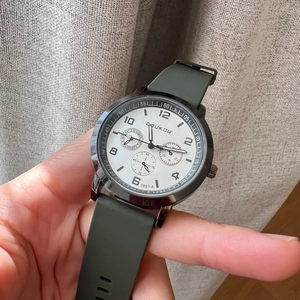 Army green silicone strap watch with white dial and functional three-eye sub-dials