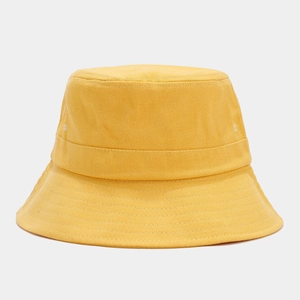 Detail of yellow cotton canvas bucket hat featuring two metal ventilation eyelets on side