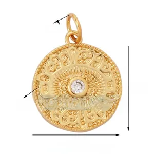 Detailed view of gold evil eye charm with 15mm diameter and central zircon inlay