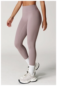 Side view of high-waisted gray-pink yoga pants with matte finish and seamless elastic fit