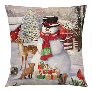 Christmas cushion cover with festive snowman and forest animals in a snowy barn scene
