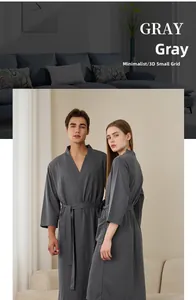 Detail of gray waffle weave bathrobe featuring a soft 3D textured fabric and kimono collar
