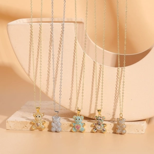 Detail showing five teddy bear necklaces with colorful zircon stones and 14K gold plating