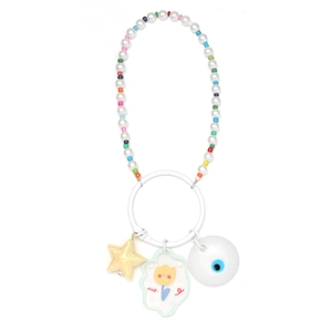 Detail of beaded keychain with pearls, yellow star, and nice cloud charm on white ring