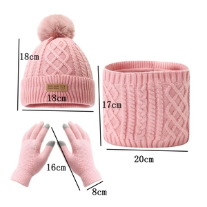 Detailed view of pink knitted winter set with beanies, gloves, and neck warmer scarf