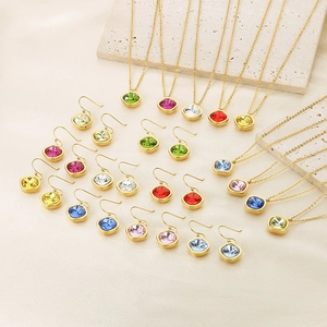Detail of square zircon jewelry sets with multi-color gems and 18k gold plated finish