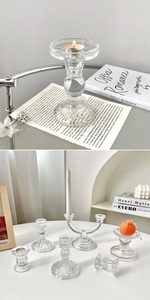 Close-up of elegant clear glass candle holders in various sizes for home decor